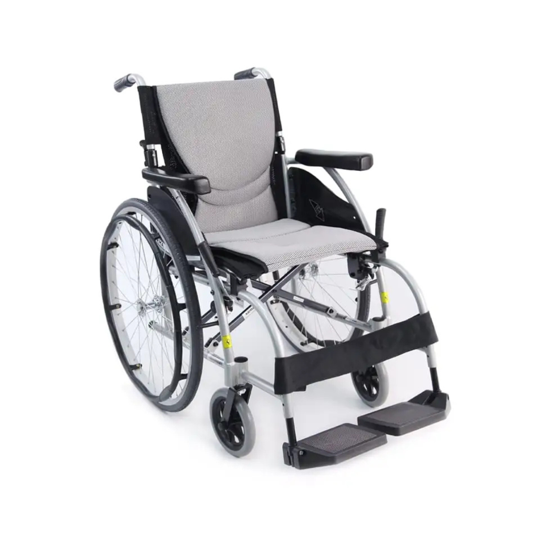 The Karman S-Ergo 105 Wheelchair offers ergonomic support with a lightweight design, featuring a gray cushioned seat and backrest for pressure relief. It has large rear wheels with hand rims, small front casters, black armrests, and foldable footrests for added convenience.